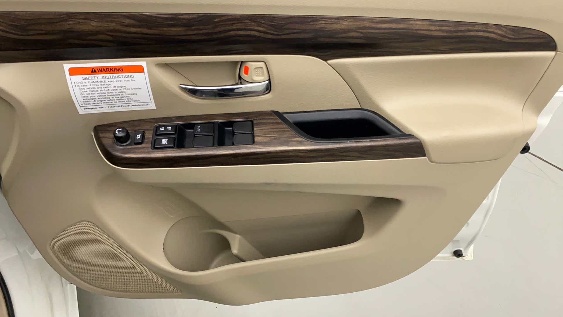 Interior driver side door panel of a Maruti Suzuki Ertiga