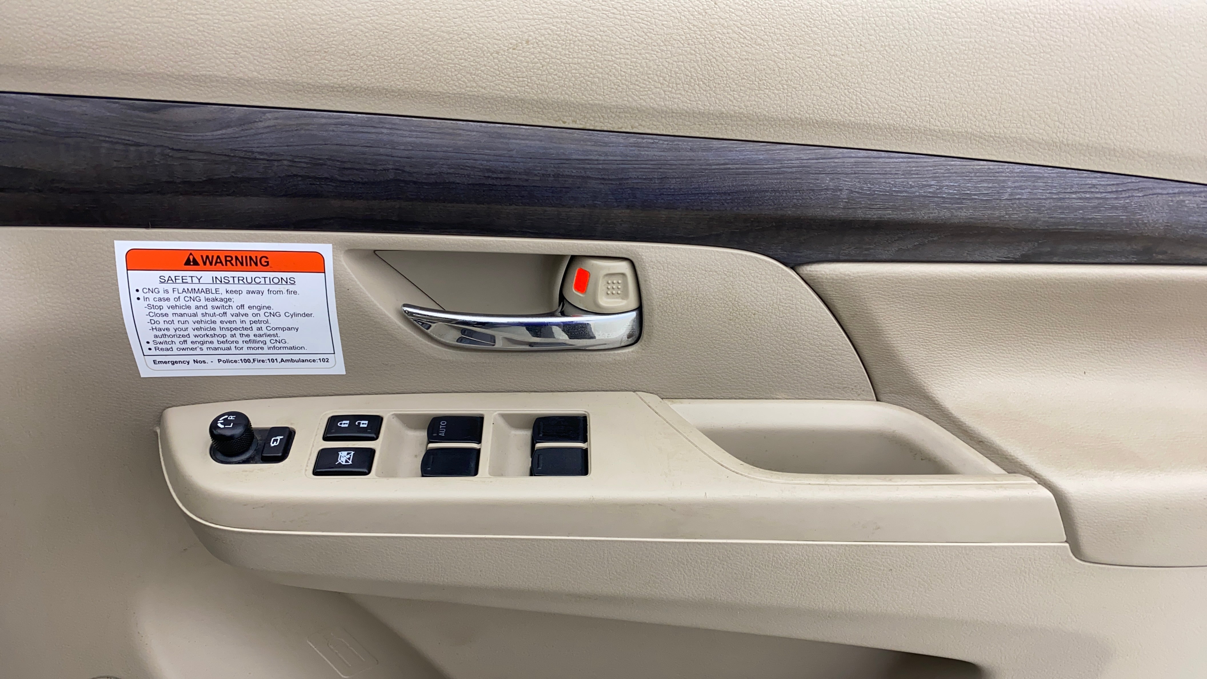 Front driver door controls of a Maruti Suzuki Ertiga