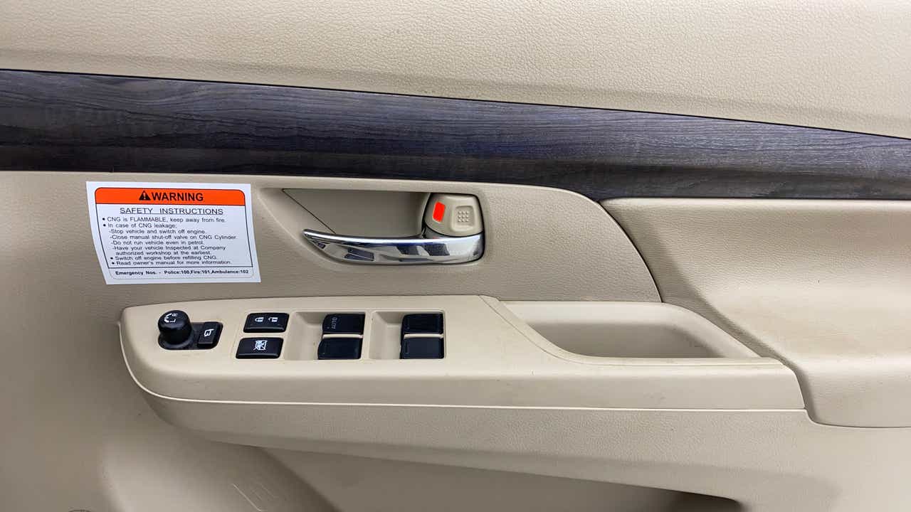 Front driver door controls of a Maruti Suzuki Ertiga