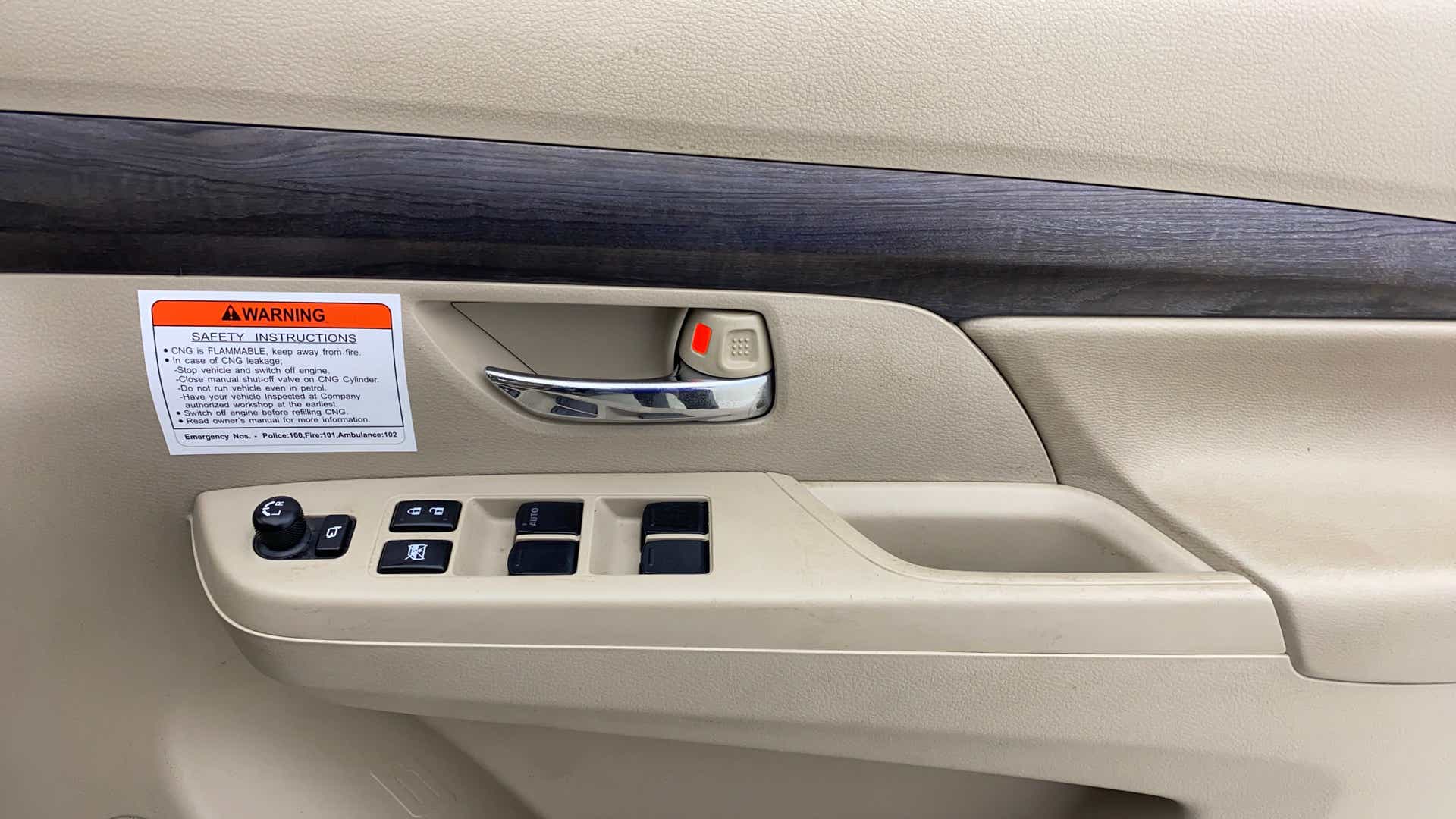 Front driver door controls of a Maruti Suzuki Ertiga
