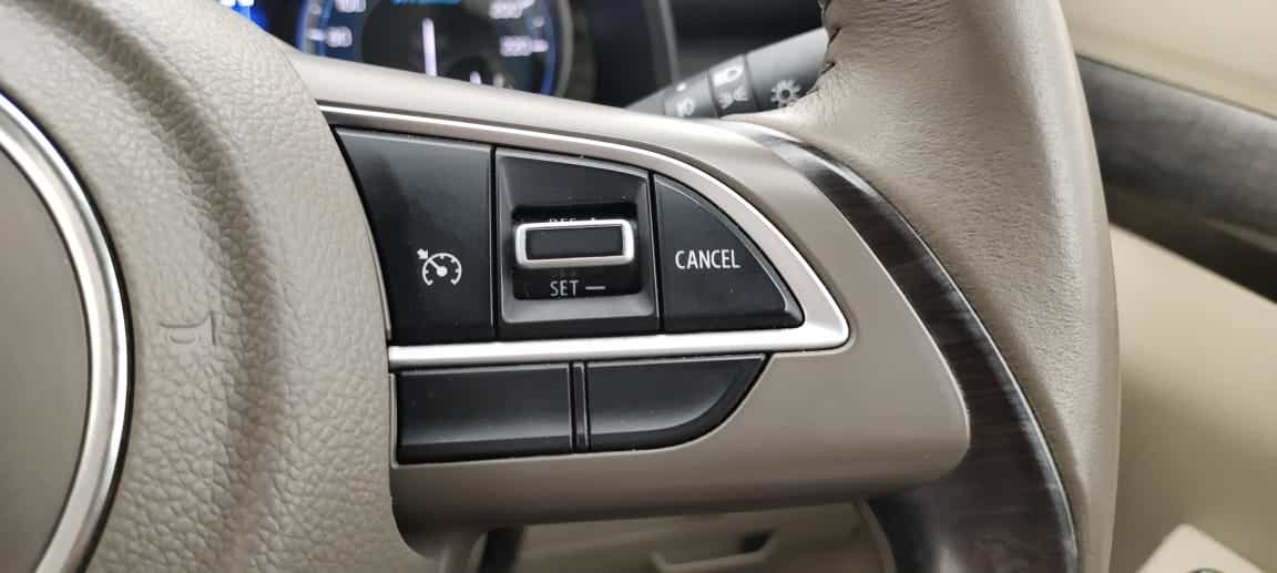 Steering wheel cruise control buttons of a Maruti Suzuki Ertiga