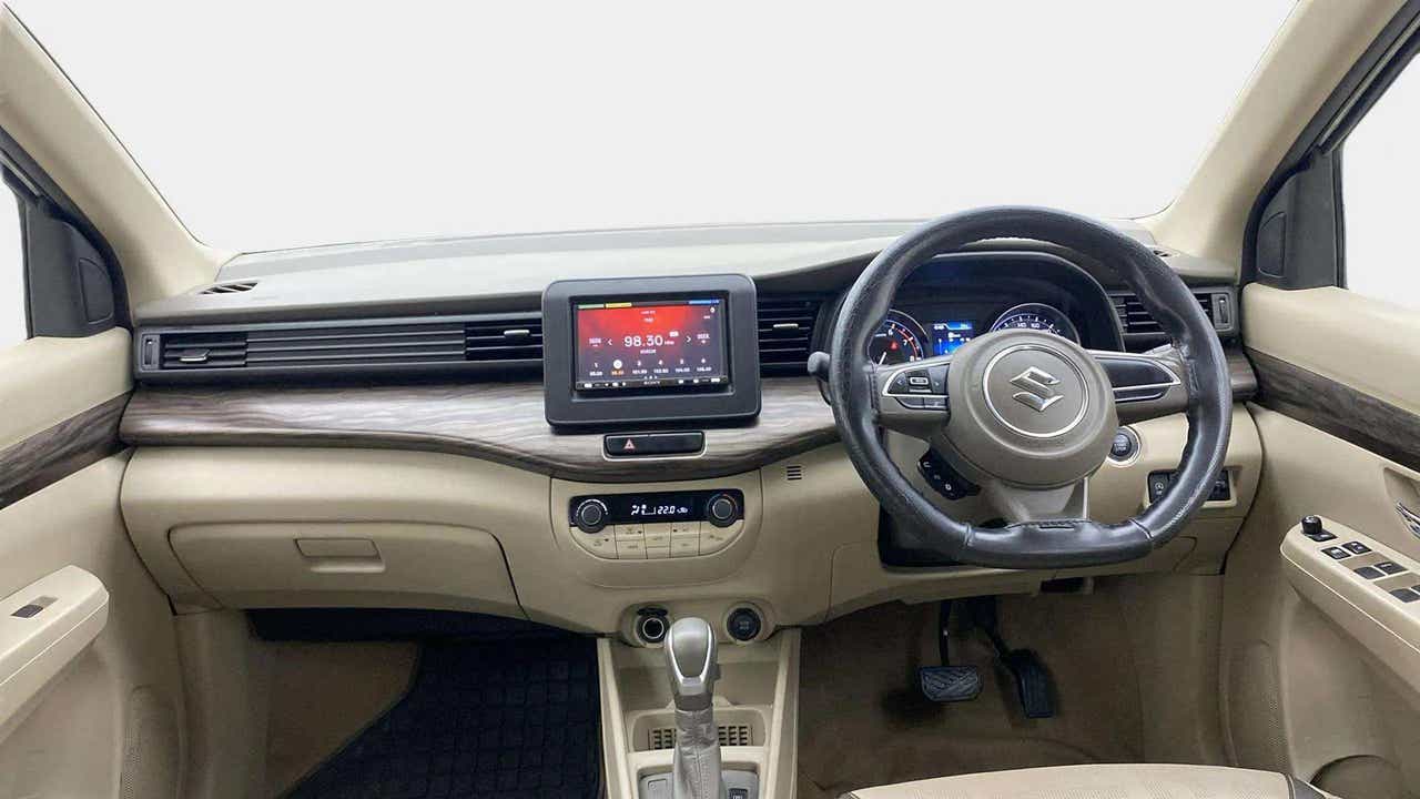 Dashboard and steering wheel view of a Maruti Suzuki Ertiga.
