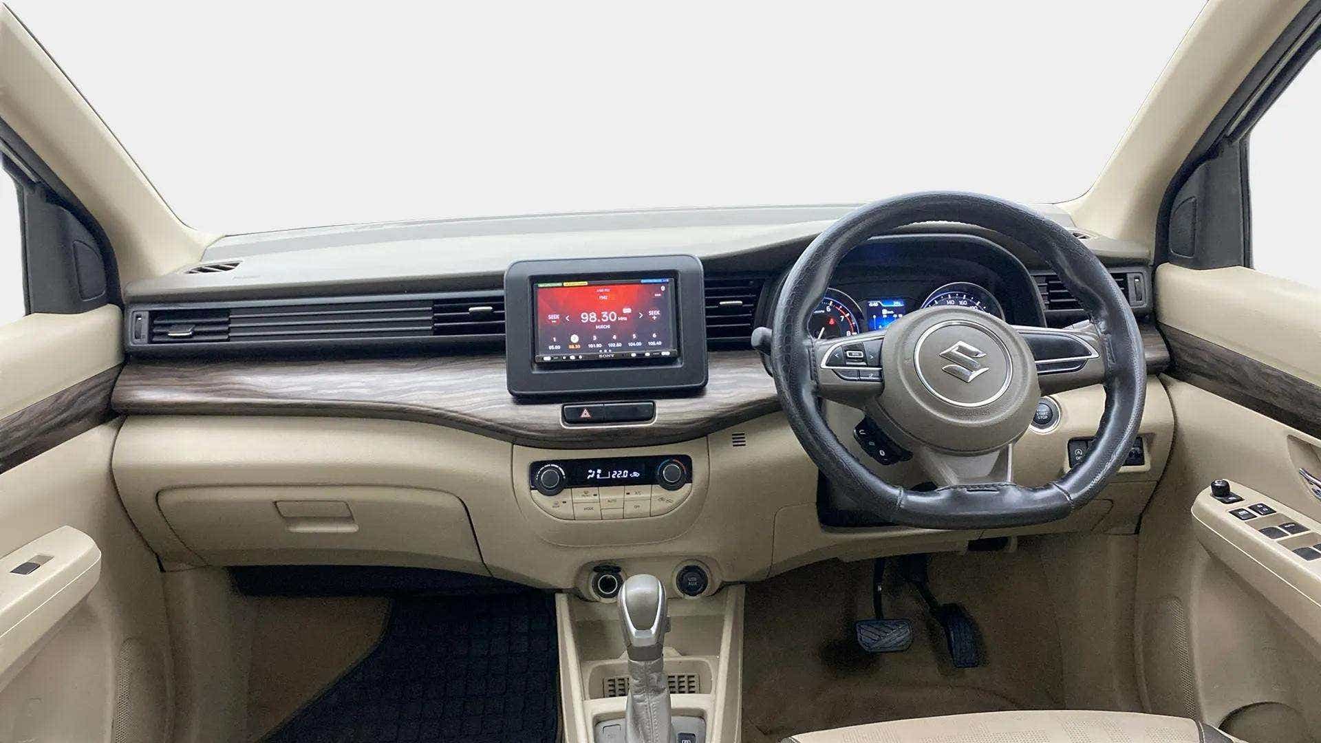 Dashboard and steering wheel view of a Maruti Suzuki Ertiga.