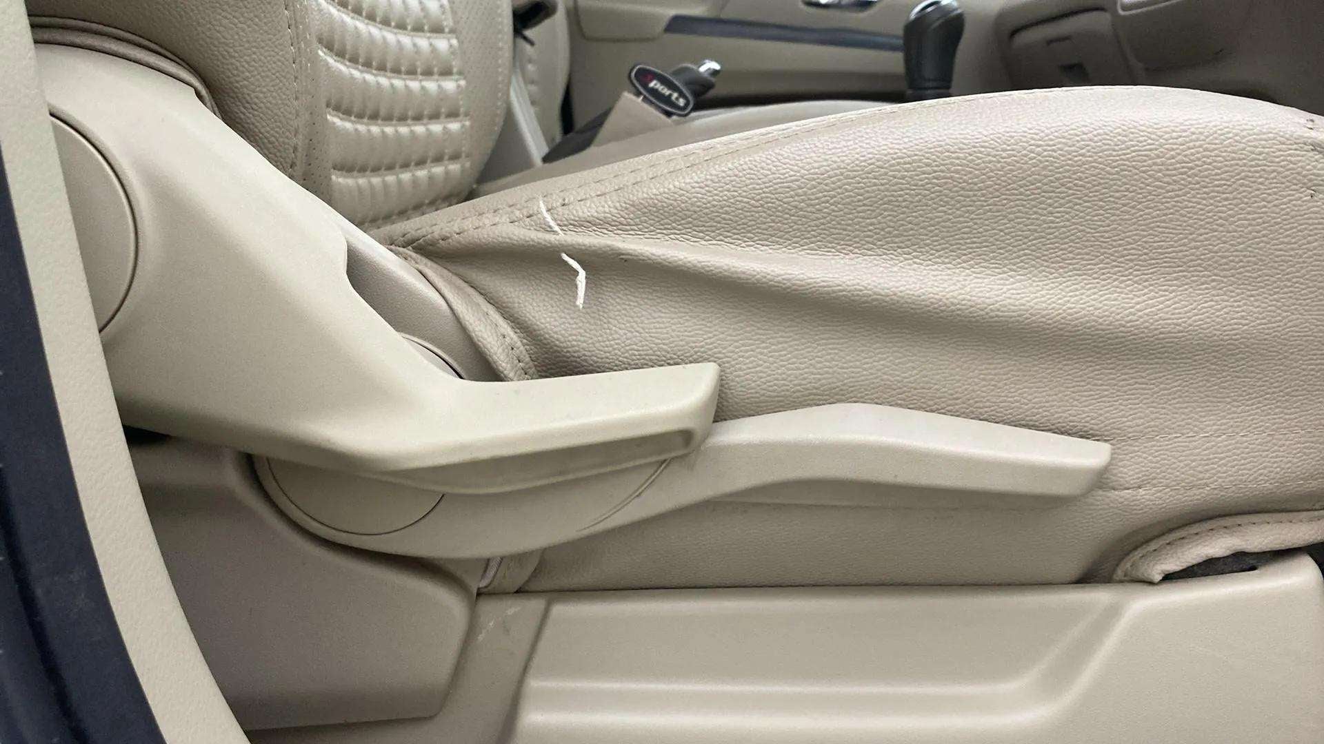 Side view of a Maruti Suzuki Ertiga front seat handle