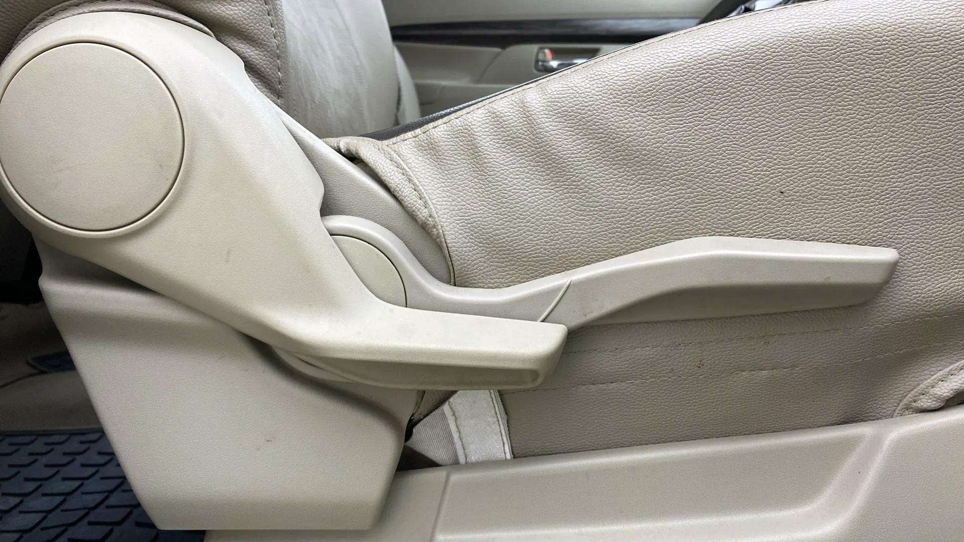 Side view of a Maruti Suzuki Ertiga car seat adjuster lever