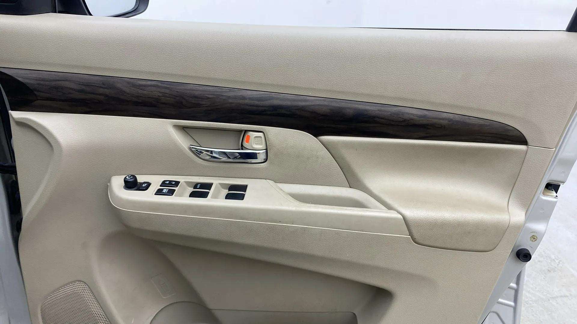 Interior front door panel of a Maruti Suzuki Ertiga