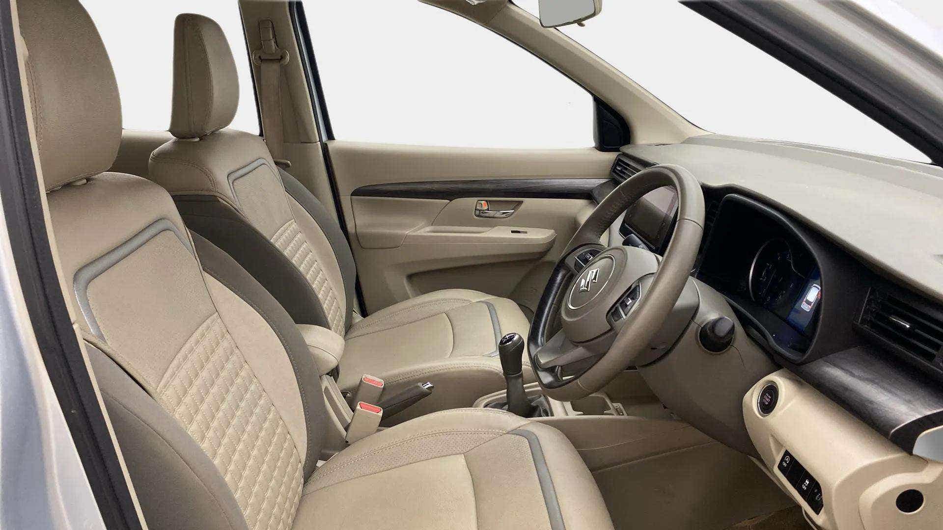 Interior dashboard and front seats of a Maruti Suzuki Ertiga