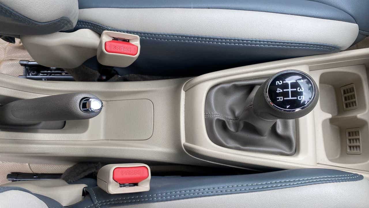 Gear lever and handbrake view of a Maruti Suzuki Ertiga