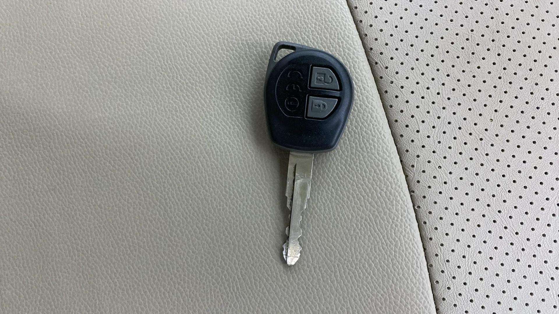 Car key fob on maruti suzuki ertiga seat upholstery
