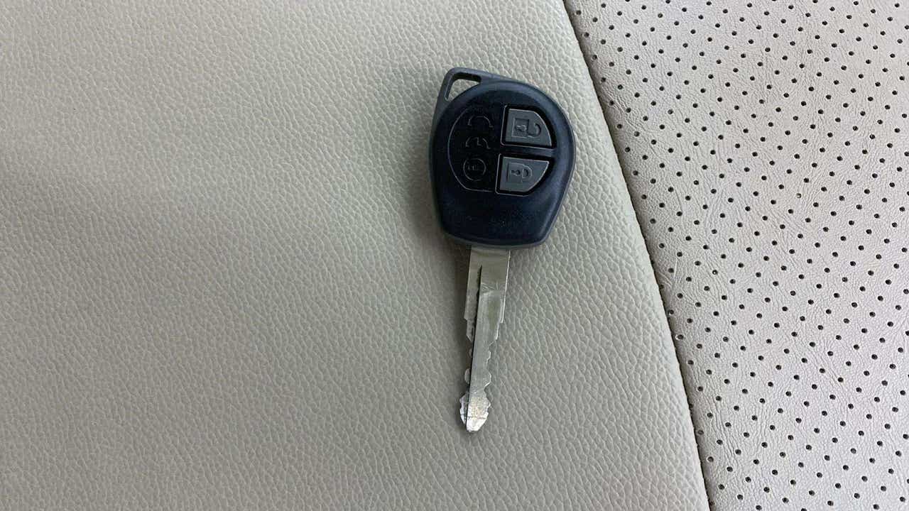 Car key fob on maruti suzuki ertiga seat upholstery