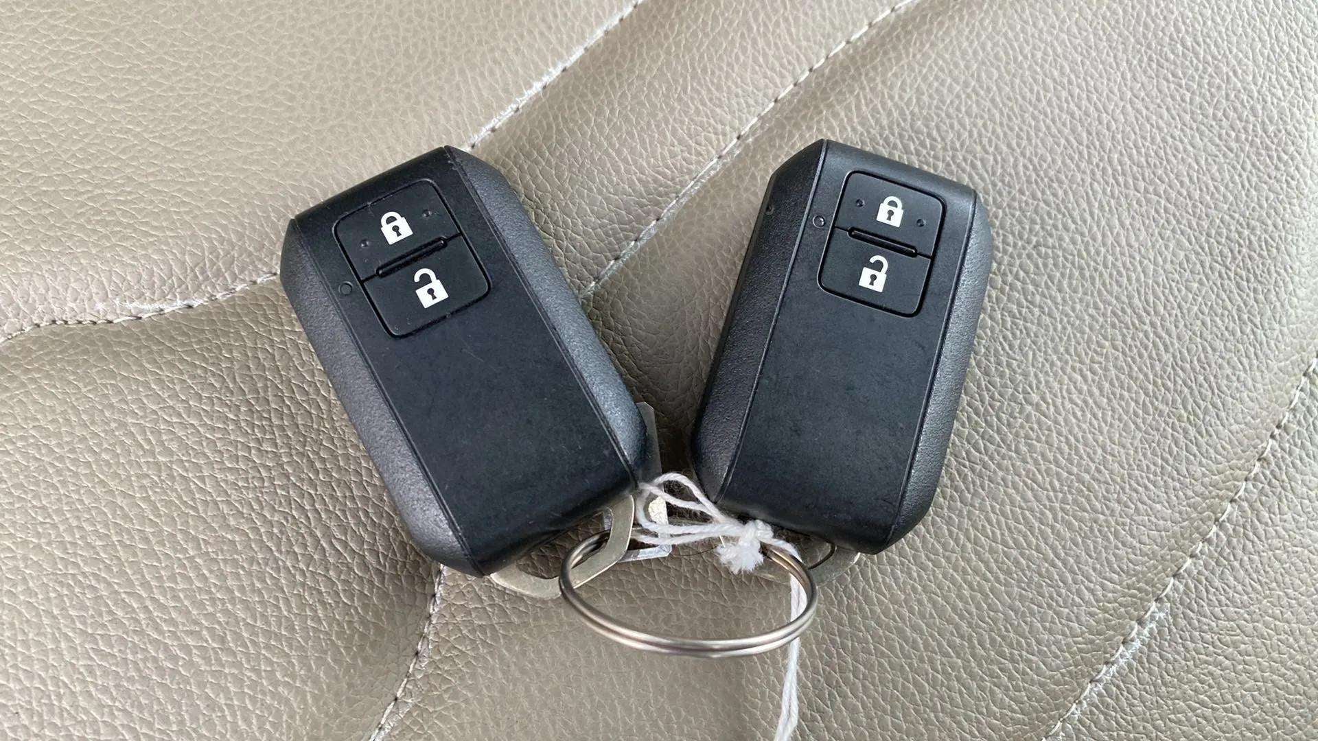 Remote key fobs on the seat of a Maruti Suzuki Ertiga