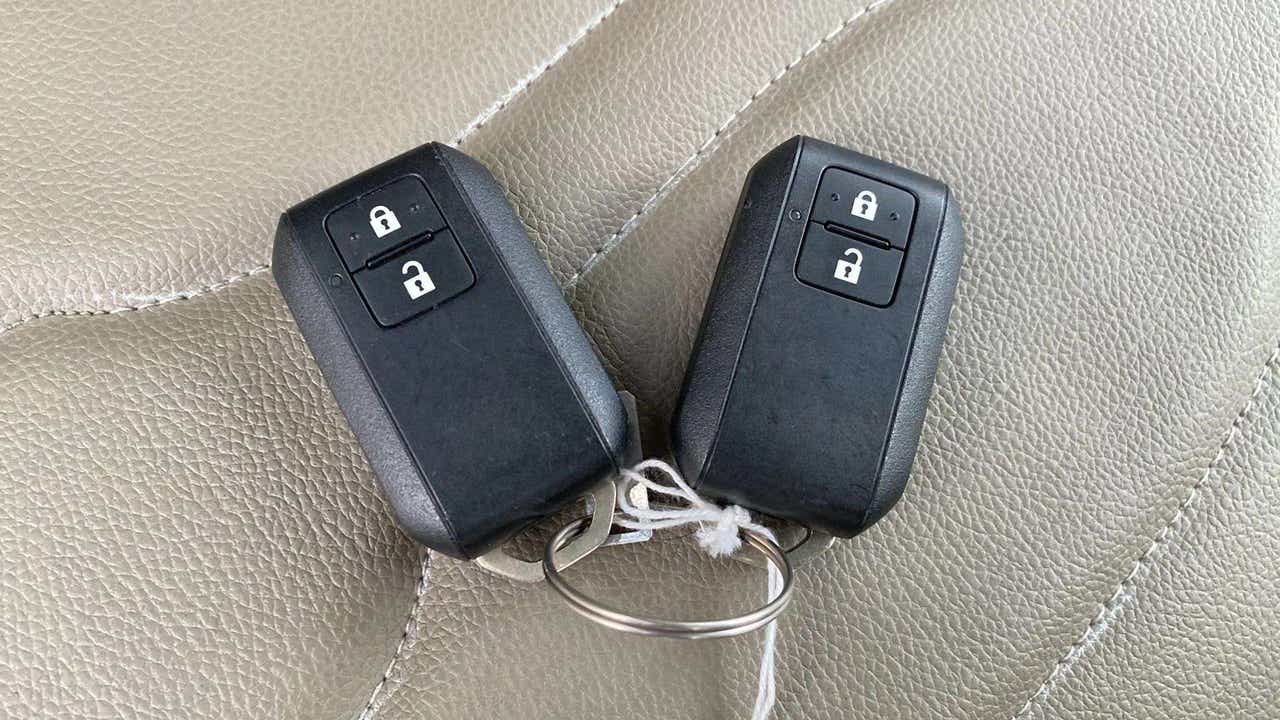 Remote key fobs on the seat of a Maruti Suzuki Ertiga