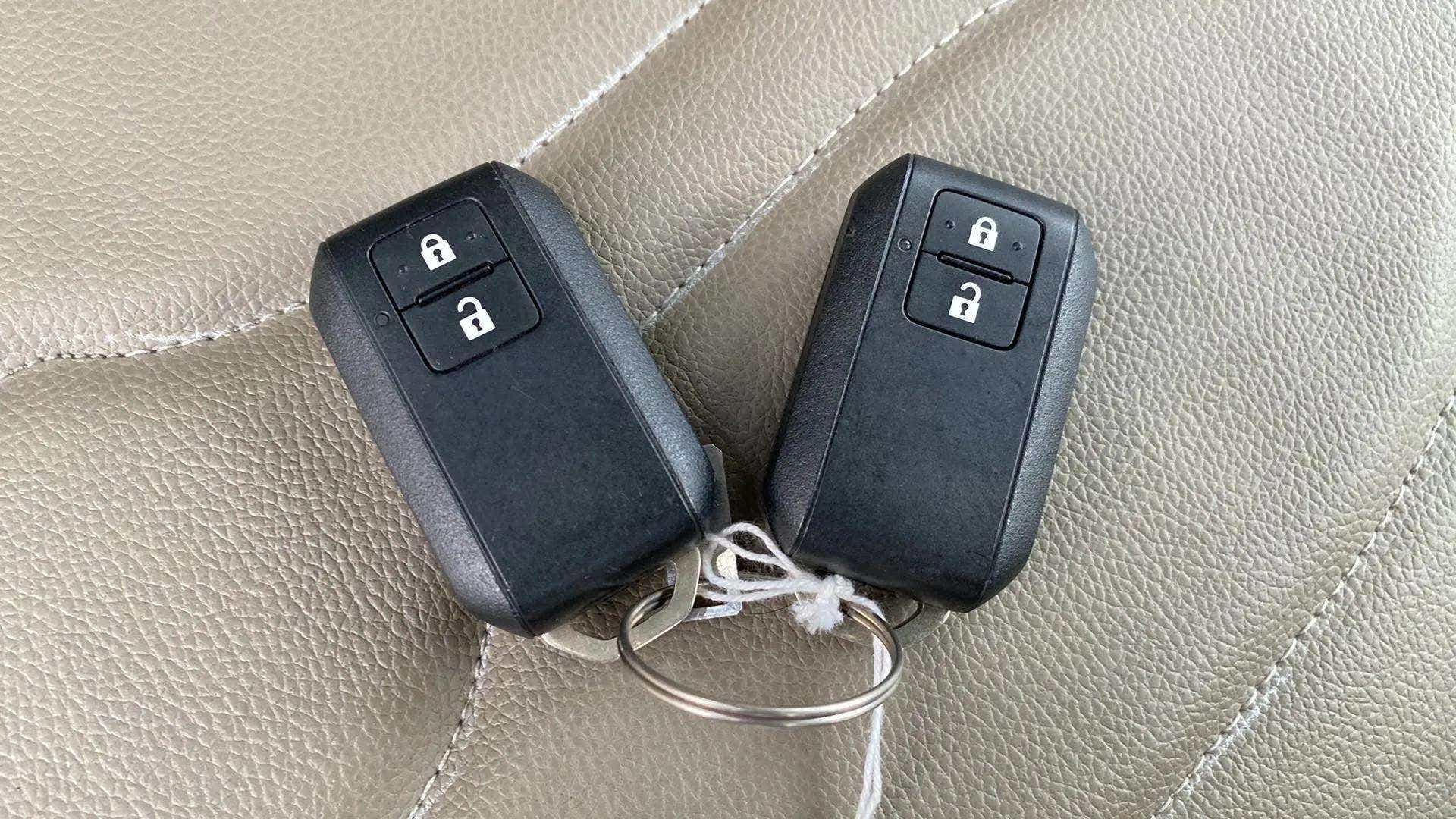 Remote key fobs on the seat of a Maruti Suzuki Ertiga