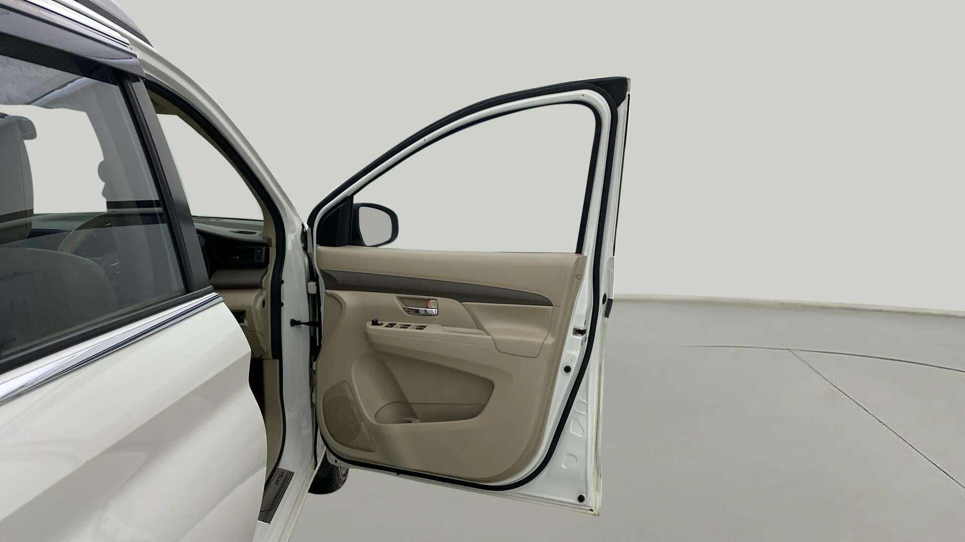 Open front driver side door view of a Maruti Suzuki Ertiga