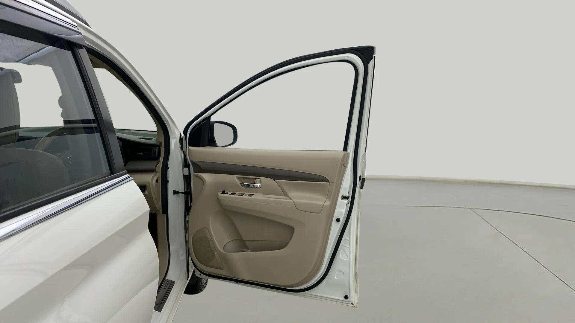 Open front driver side door view of a Maruti Suzuki Ertiga