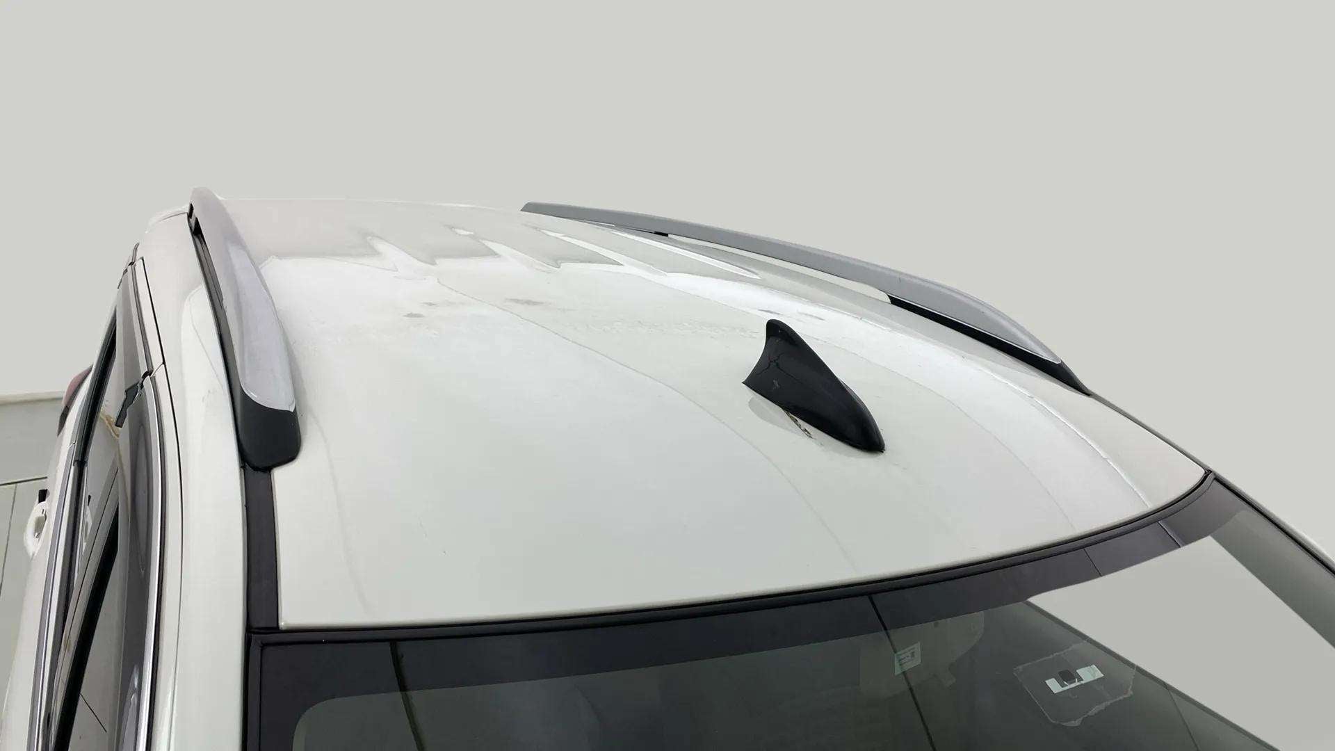 Roof with rails and shark fin antenna of a Maruti Suzuki Ertiga