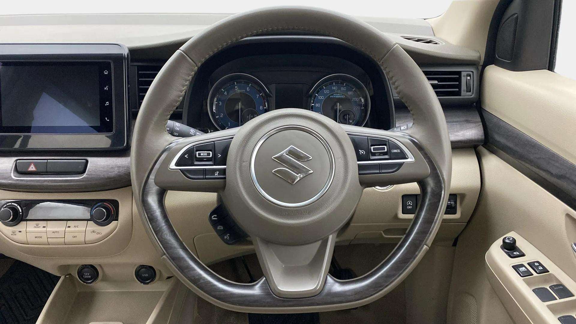 Steering wheel and dashboard of a Maruti Suzuki Ertiga