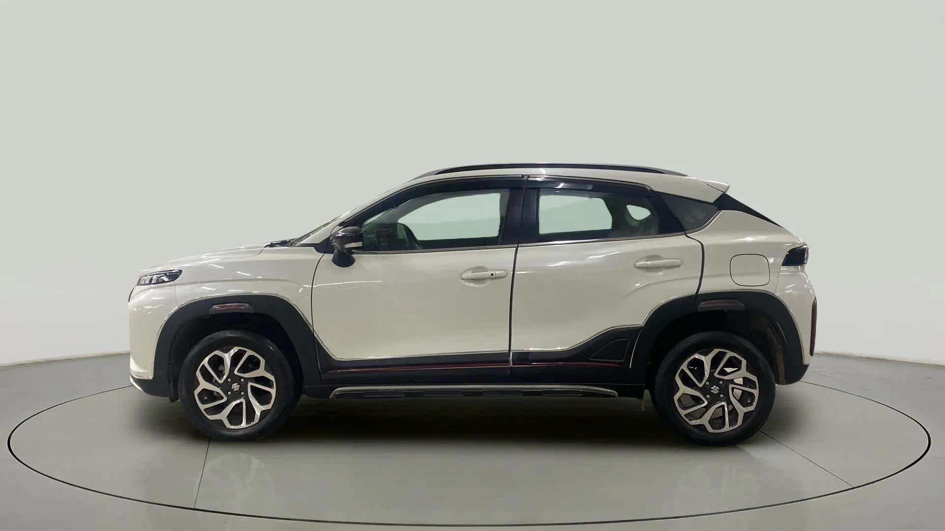Side view of a Maruti Suzuki FRONX
