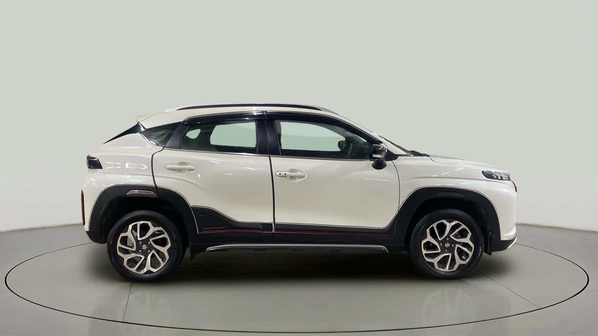 Side view of a Maruti Suzuki FRONX