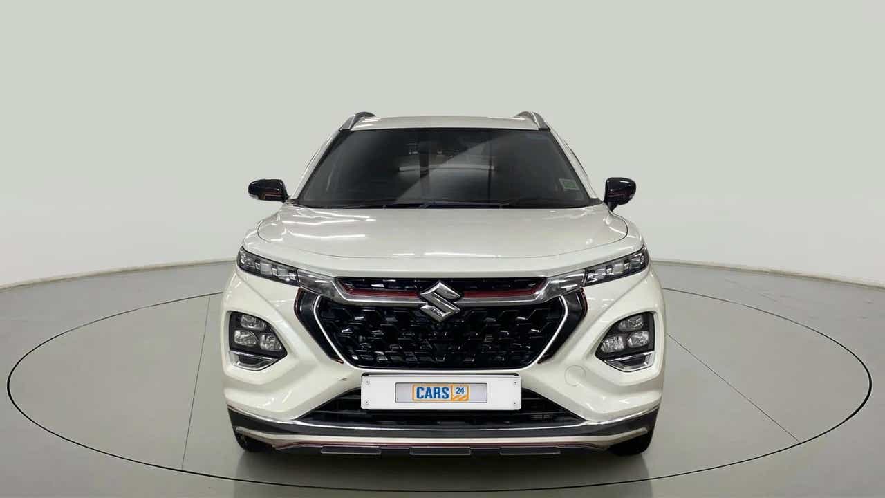 Front view of a arctic white Maruti Suzuki FRONX