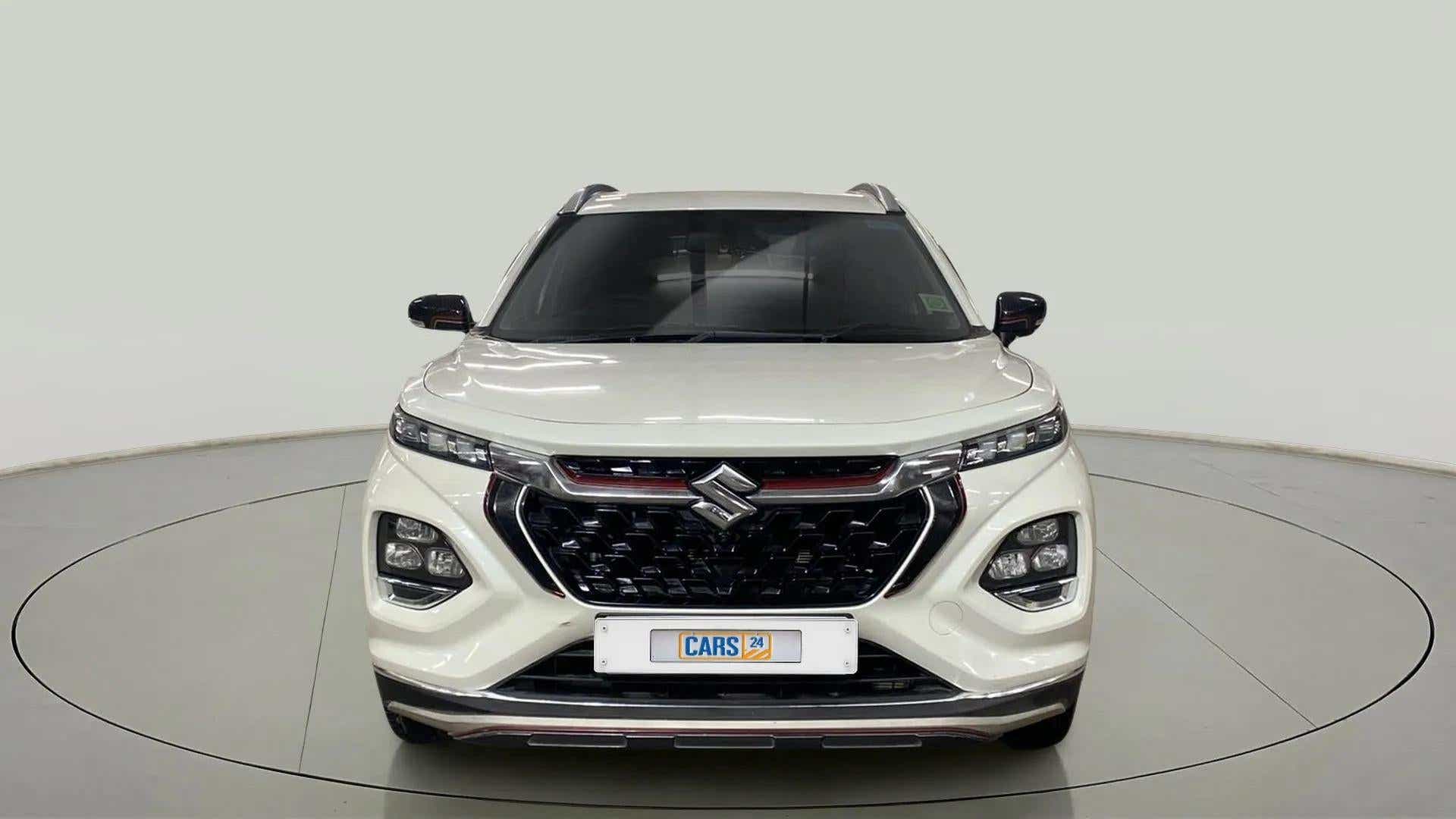 Front view of a arctic white Maruti Suzuki FRONX