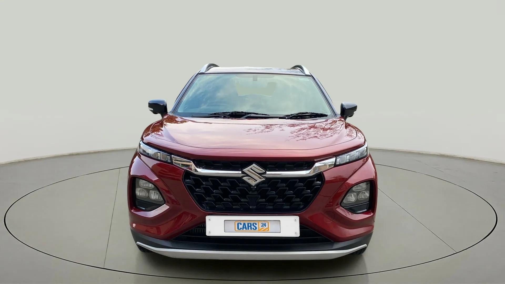 Front view of a opulent red Maruti Suzuki FRONX