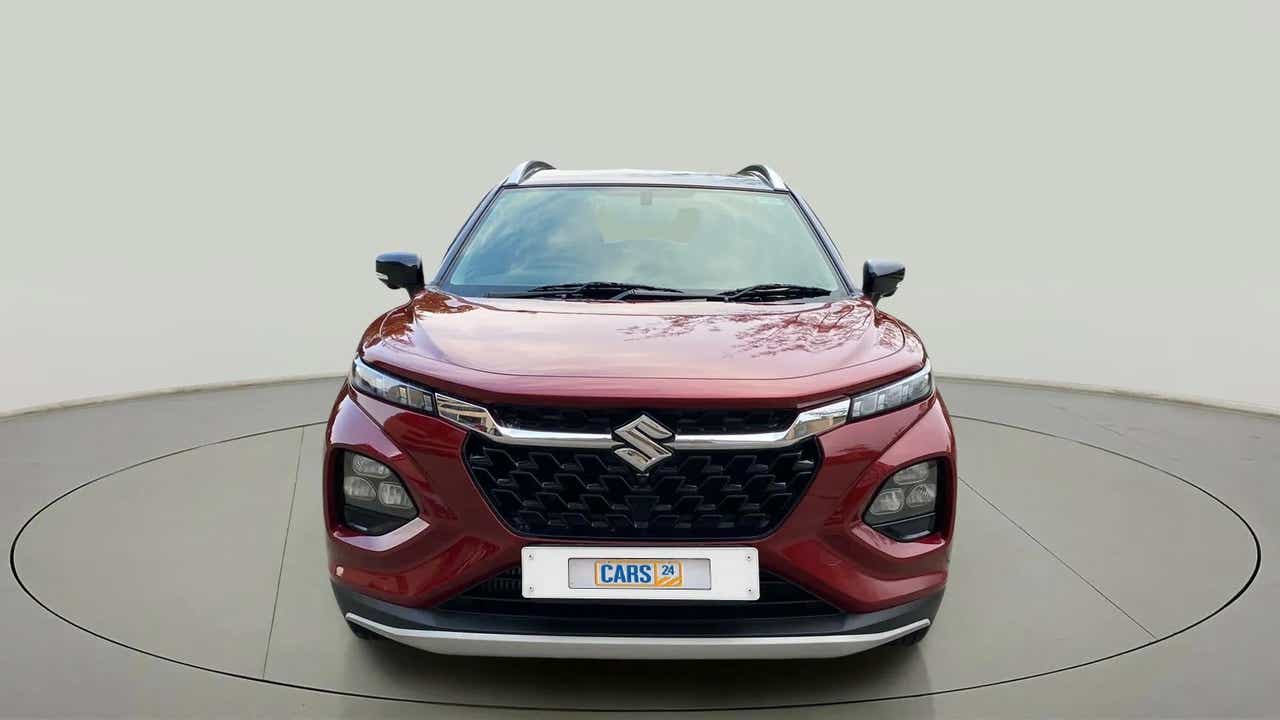 Front view of a opulent red Maruti Suzuki FRONX
