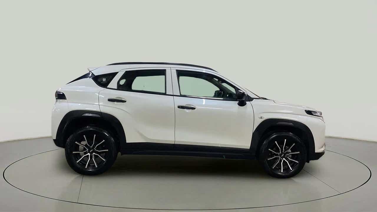 Side view of a Maruti Suzuki FRONX