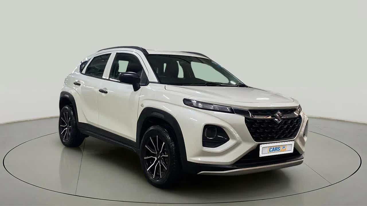 Front three-quarter view of a arctic white Maruti Suzuki FRONX