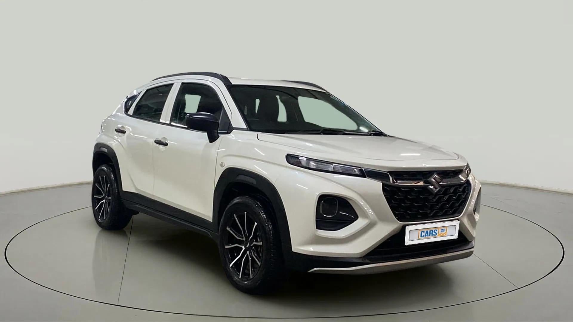 Front three-quarter view of a arctic white Maruti Suzuki FRONX