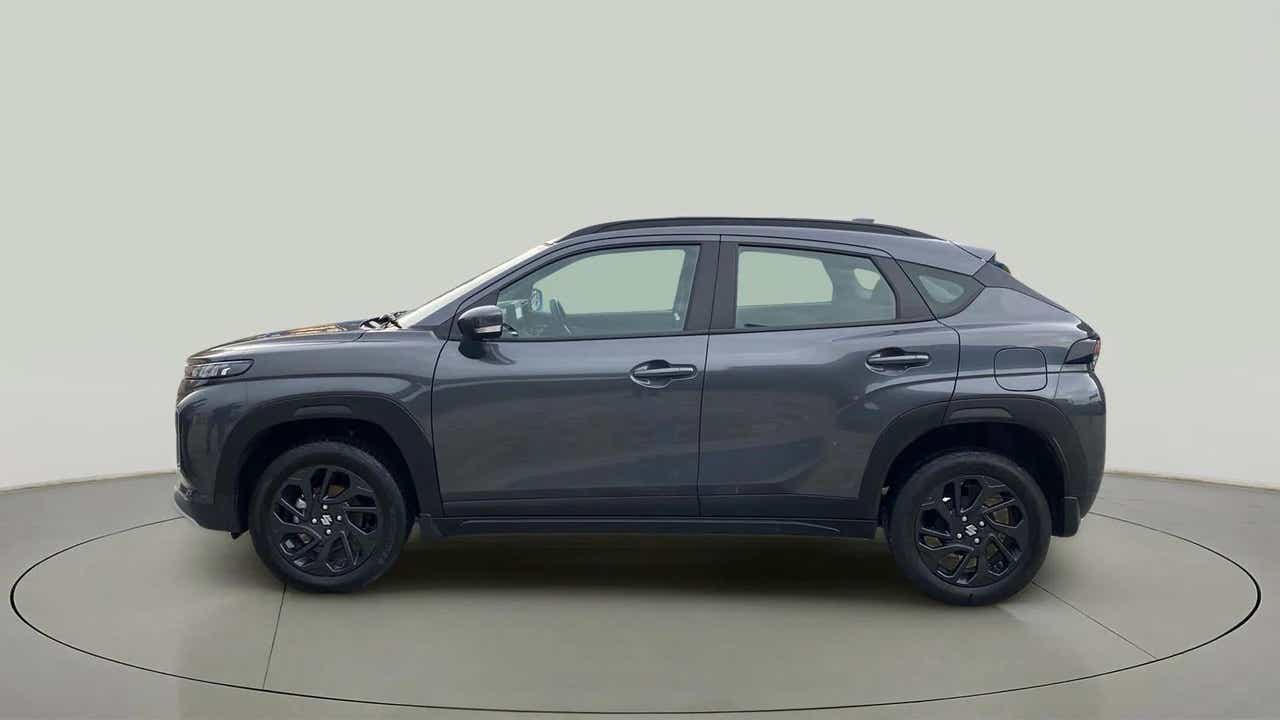 Side view of a Grandeur Grey Maruti Suzuki FRONX
