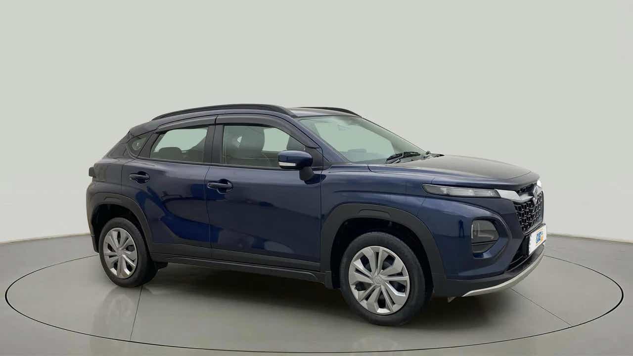 Side view of a Nexa Blue Maruti Suzuki FRONX