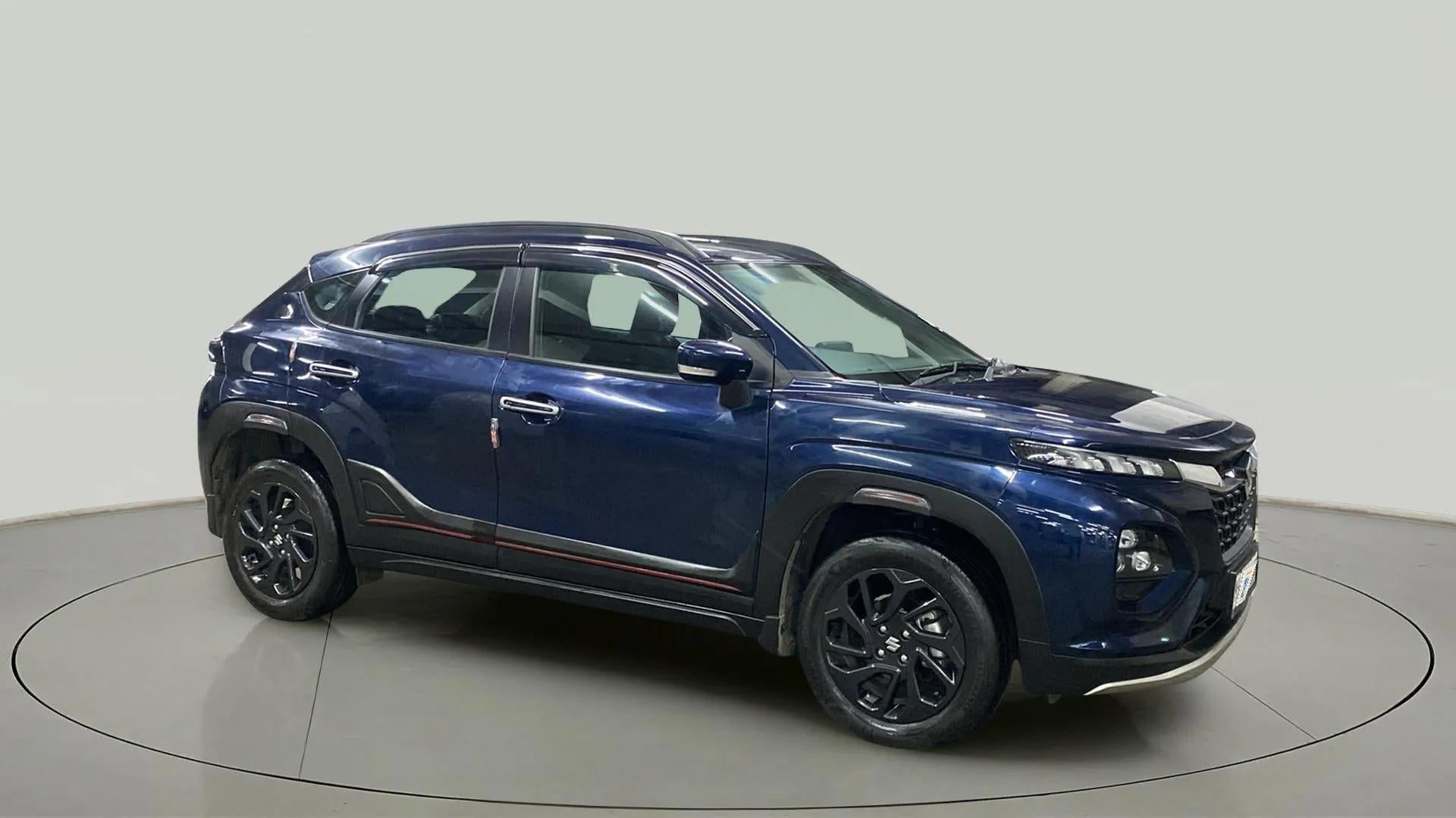 Side view of a Nexa Blue Maruti Suzuki FRONX