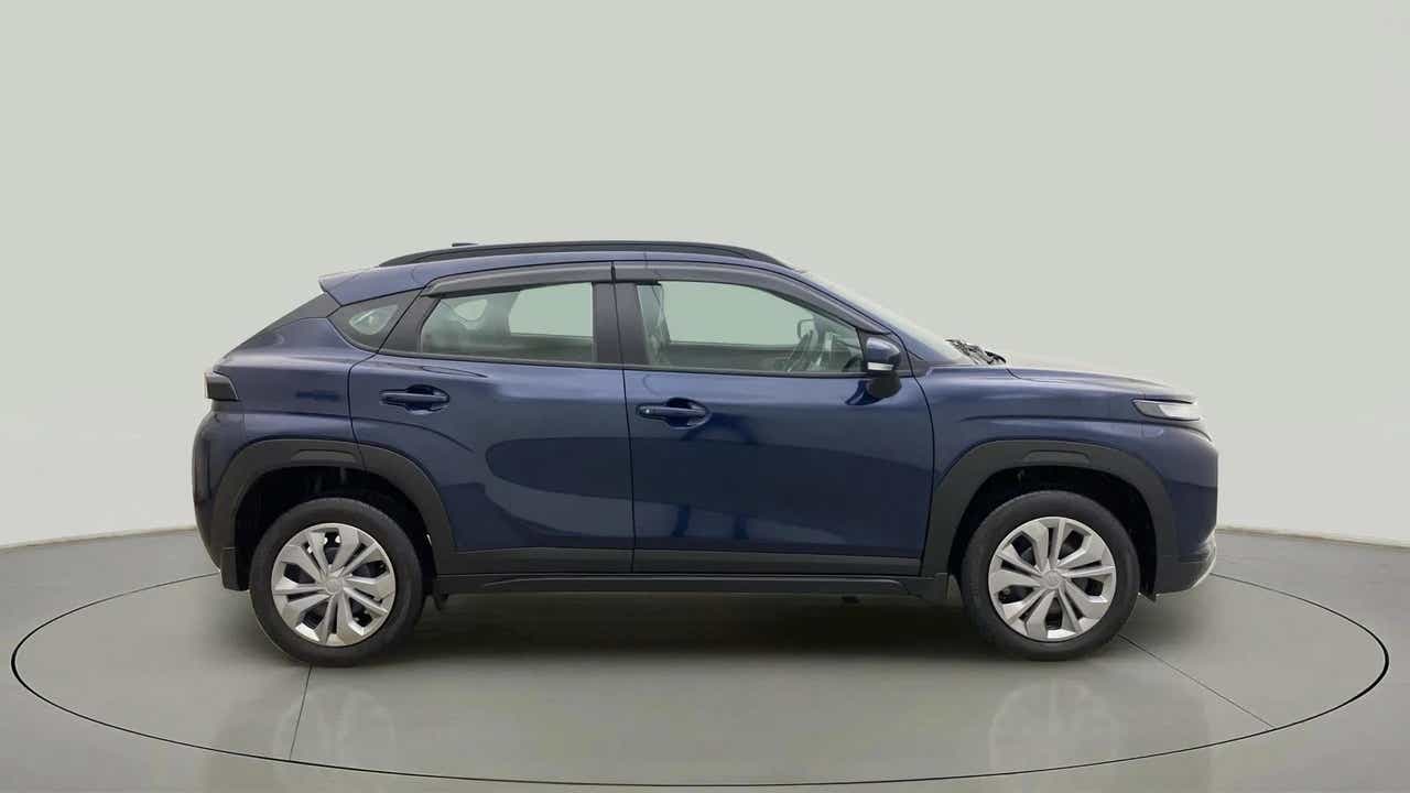 Side view of a Nexa Blue Maruti Suzuki FRONX