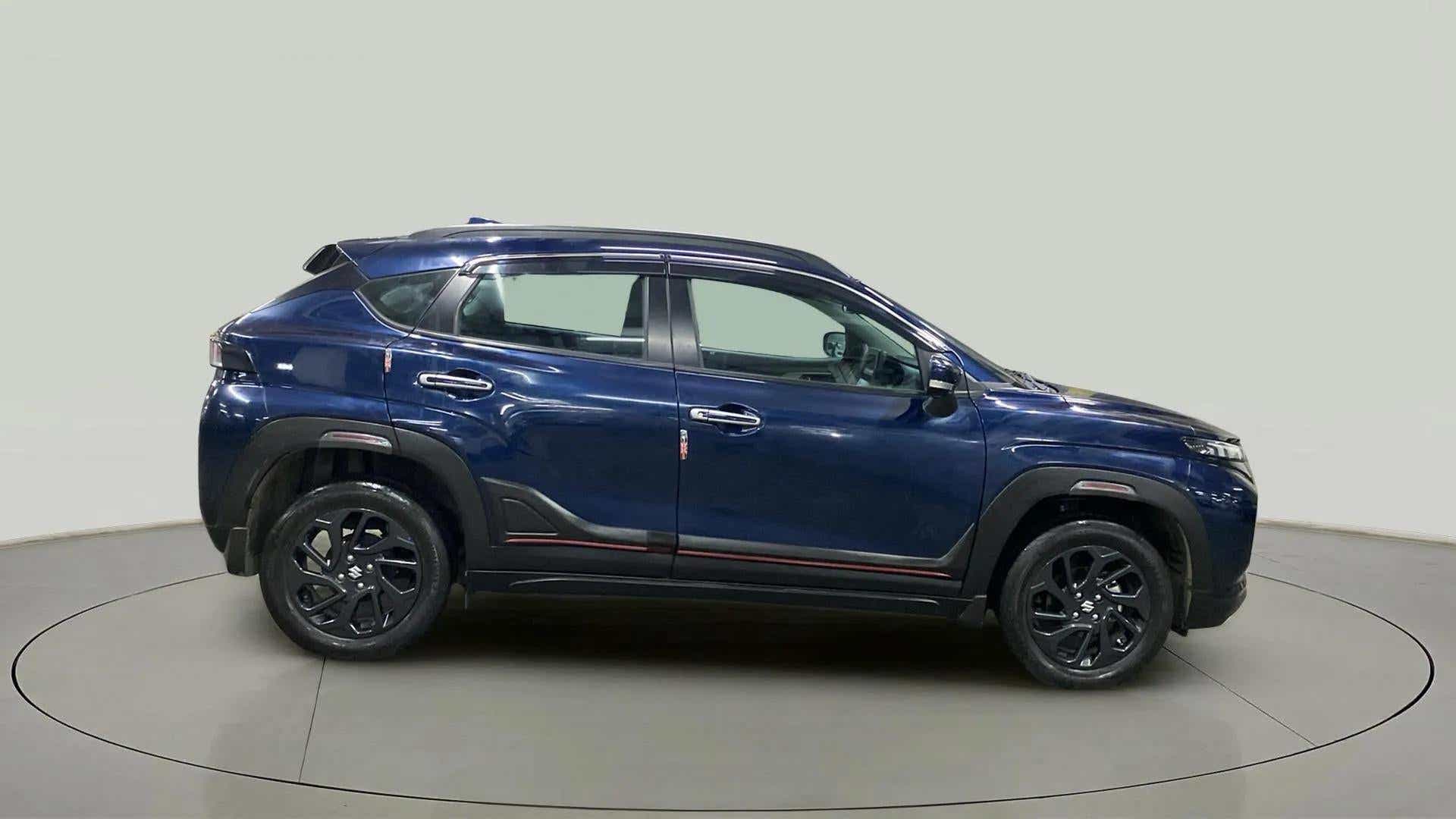 Side view of a Nexa Blue Maruti Suzuki FRONX