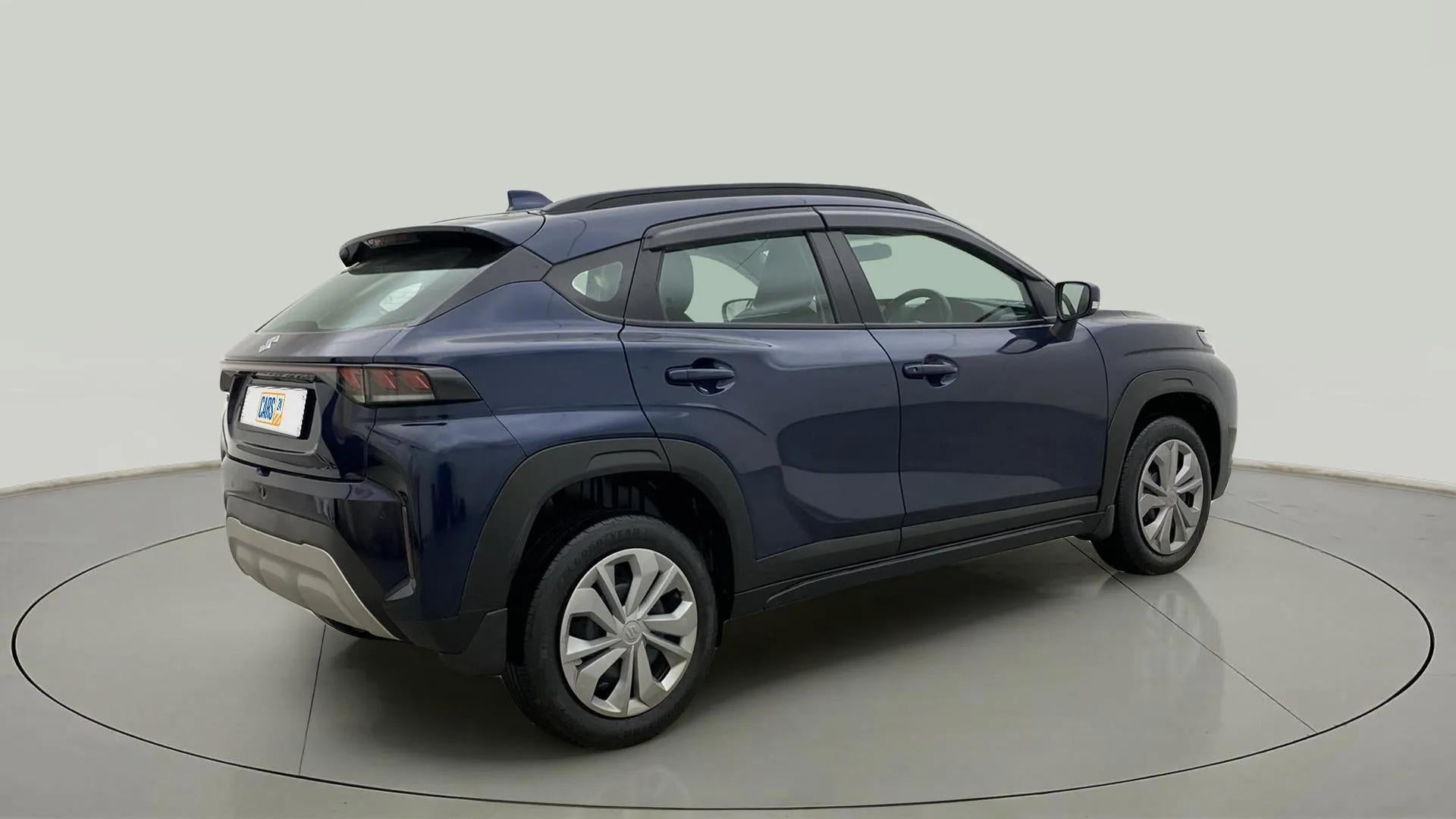 Rear three-quarter view of a Nexa Blue Maruti Suzuki FRONX