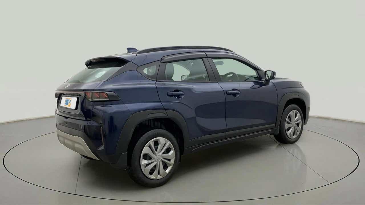Rear three-quarter view of a Nexa Blue Maruti Suzuki FRONX