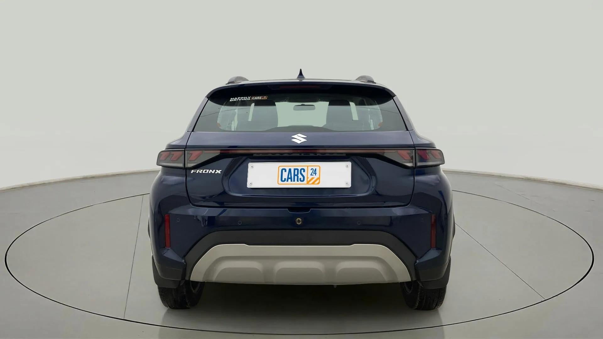 Rear view of a nexa blue Maruti Suzuki FRONX