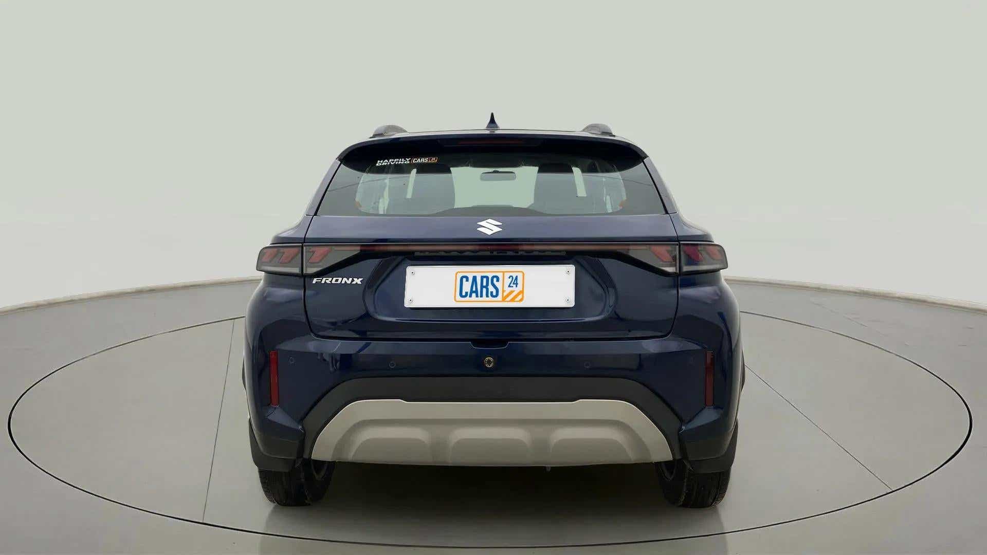 Rear view of a nexa blue Maruti Suzuki FRONX