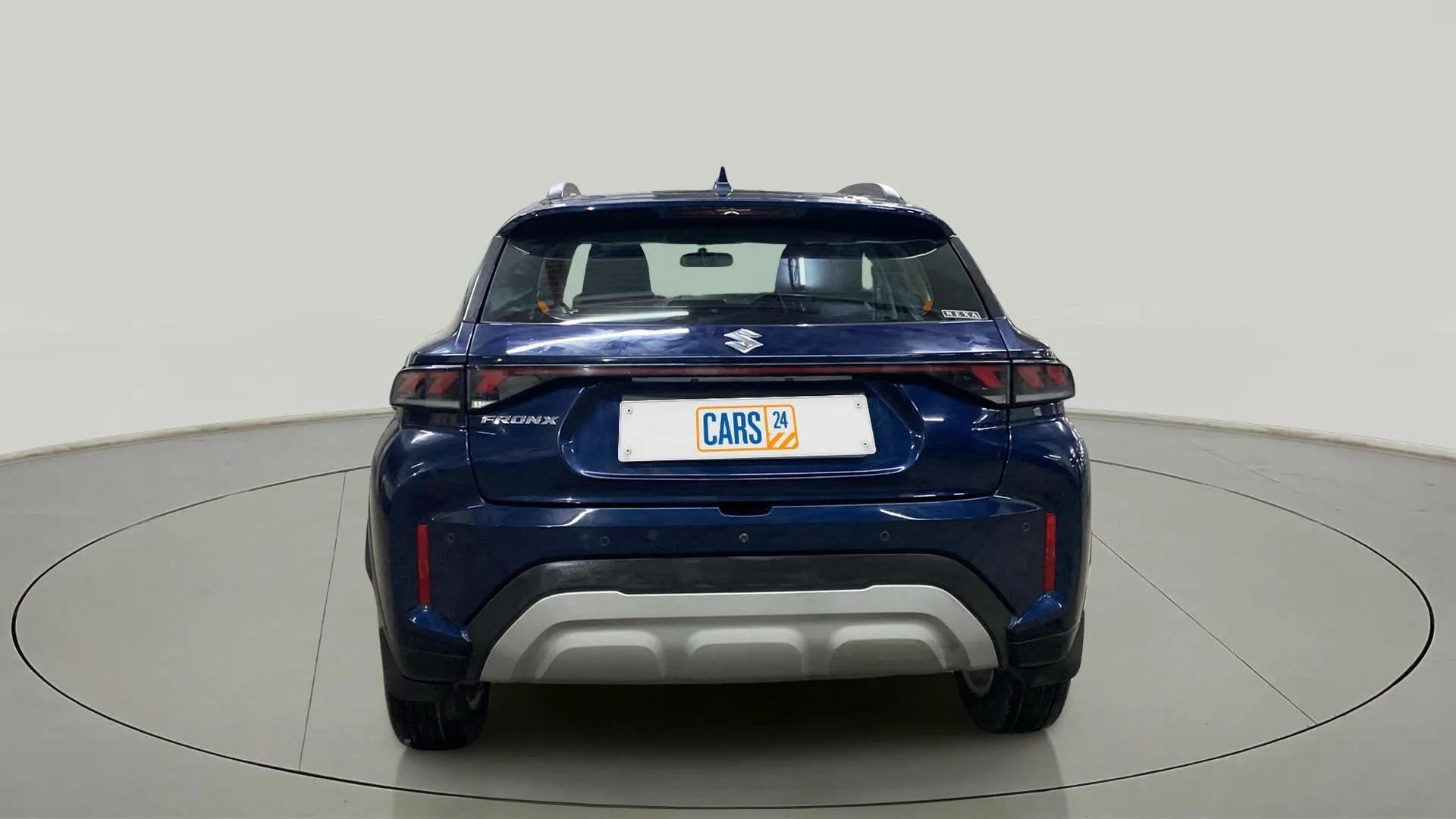 Rear view of a Nexa Blue Maruti Suzuki FRONX