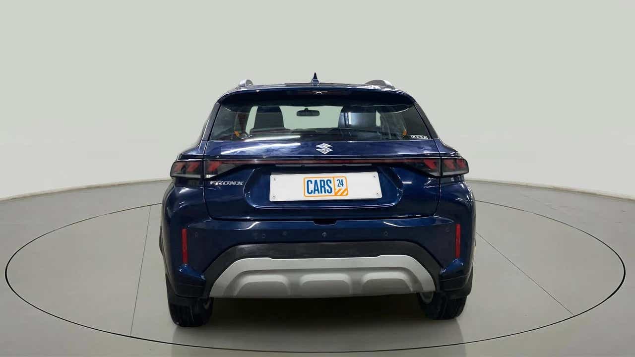 Rear view of a Nexa Blue Maruti Suzuki FRONX