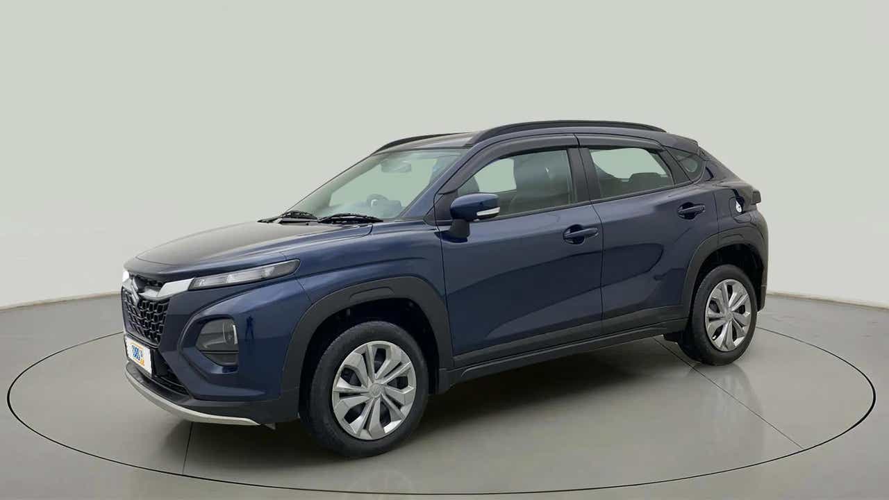 Front three quarter view of a Nexa Blue Maruti Suzuki FRONX