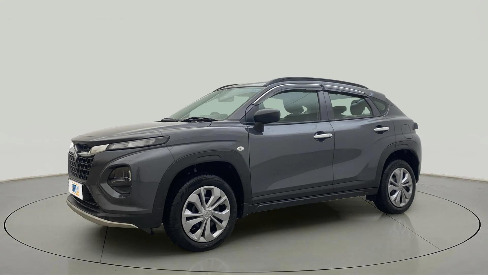 Front side view of a Grandeur Grey Maruti Suzuki FRONX