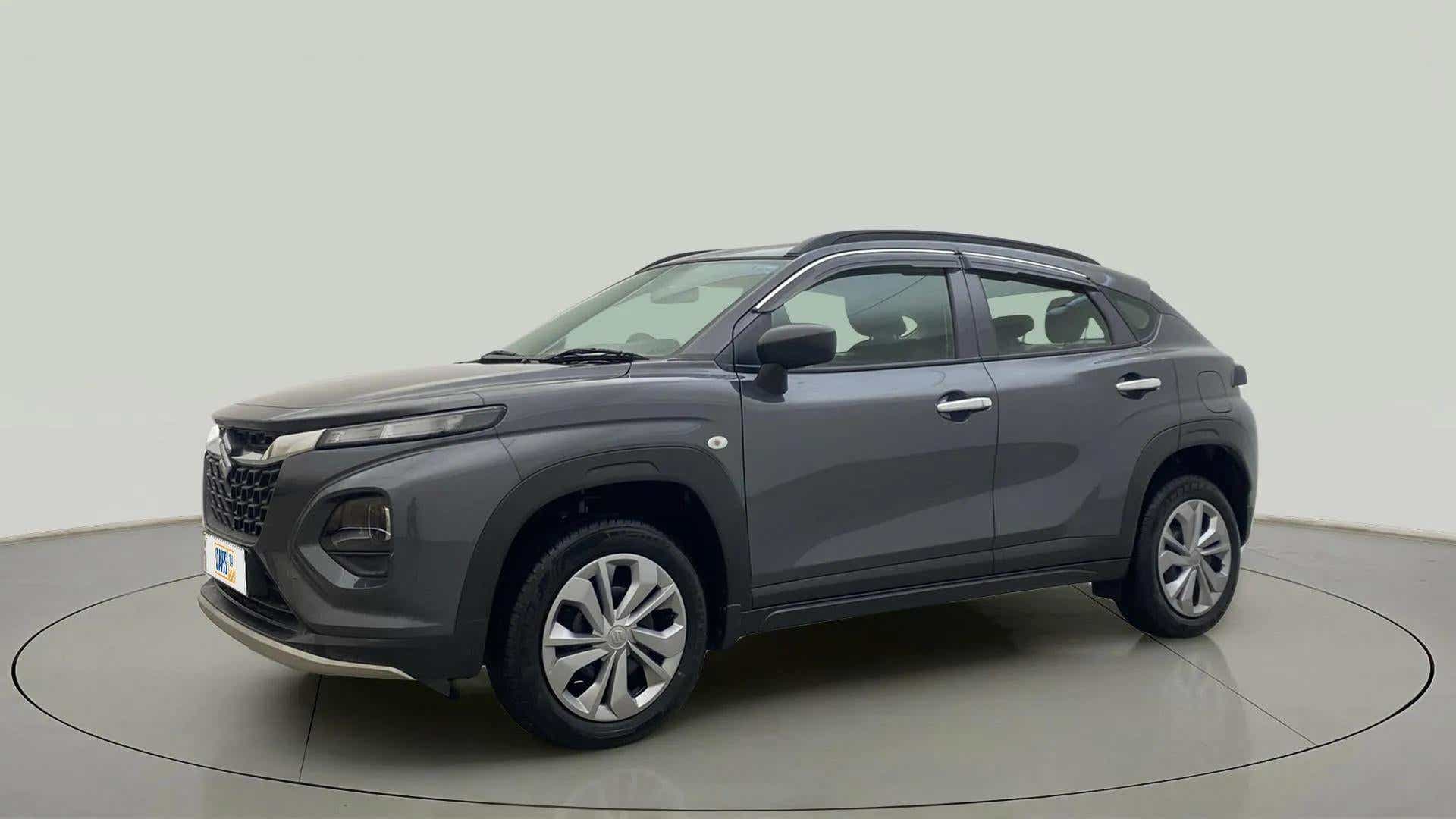 Front side view of a Grandeur Grey Maruti Suzuki FRONX