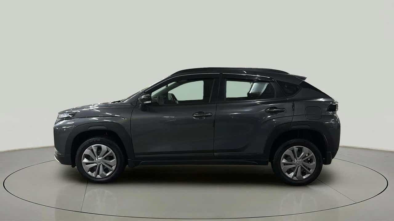 Side profile of a Grandeur Grey Maruti Suzuki FRONX