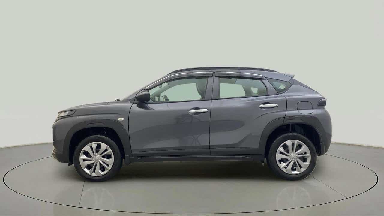 Side view of a Grandeur Grey Maruti Suzuki FRONX
