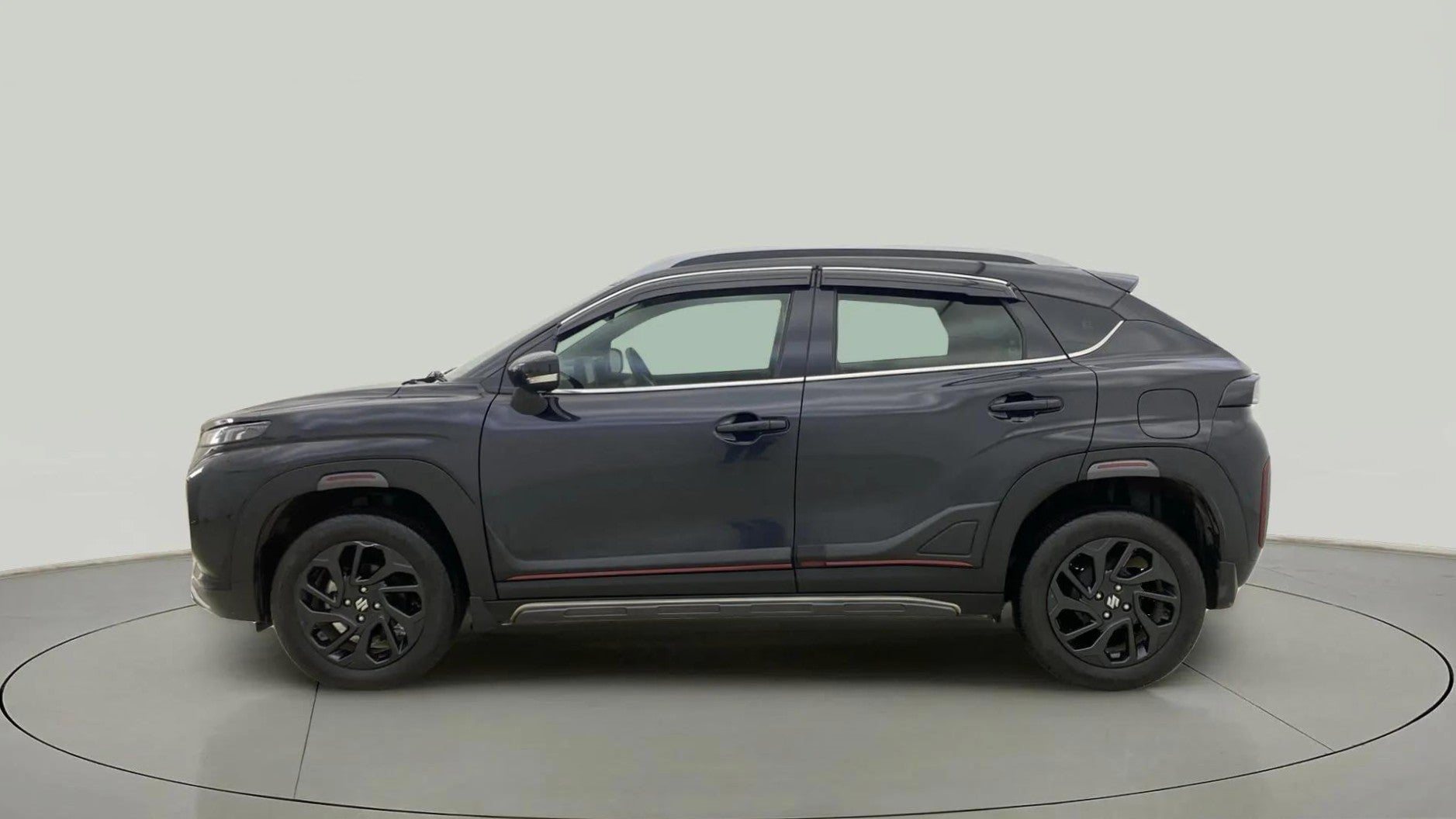 Side view of a Maruti Suzuki FRONX