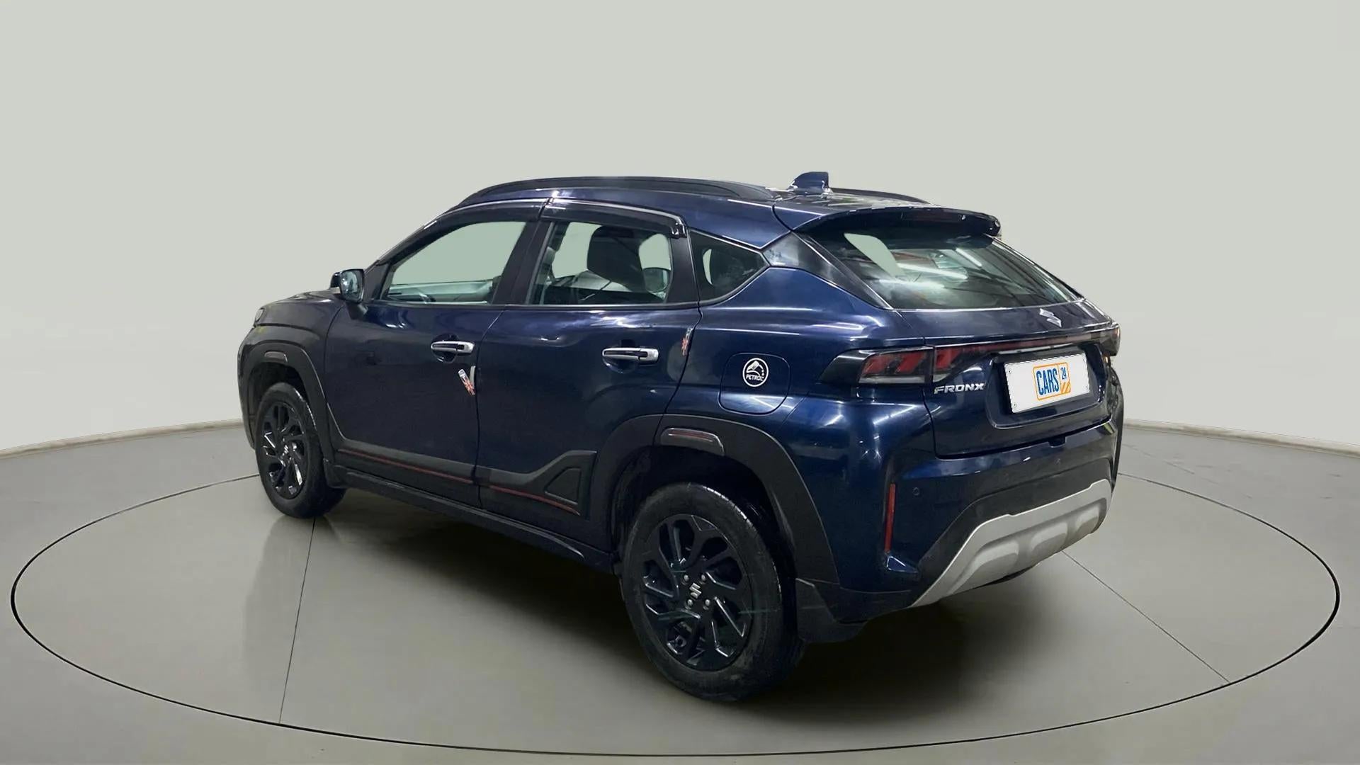 Rear three-quarter of a Nexa Blue Maruti Suzuki FRONX