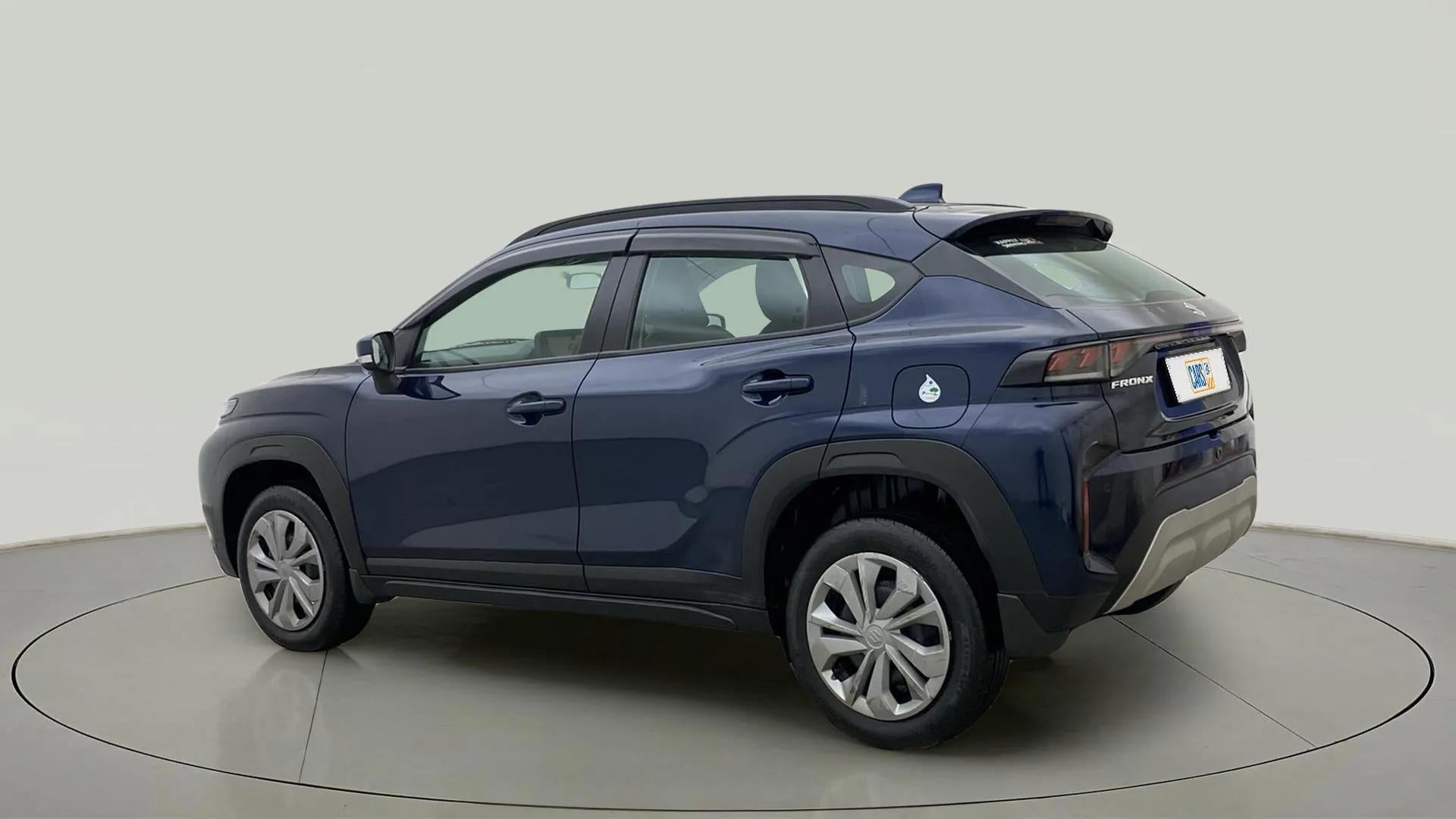 Rear three-quarter of a Nexa Blue Maruti Suzuki FRONX