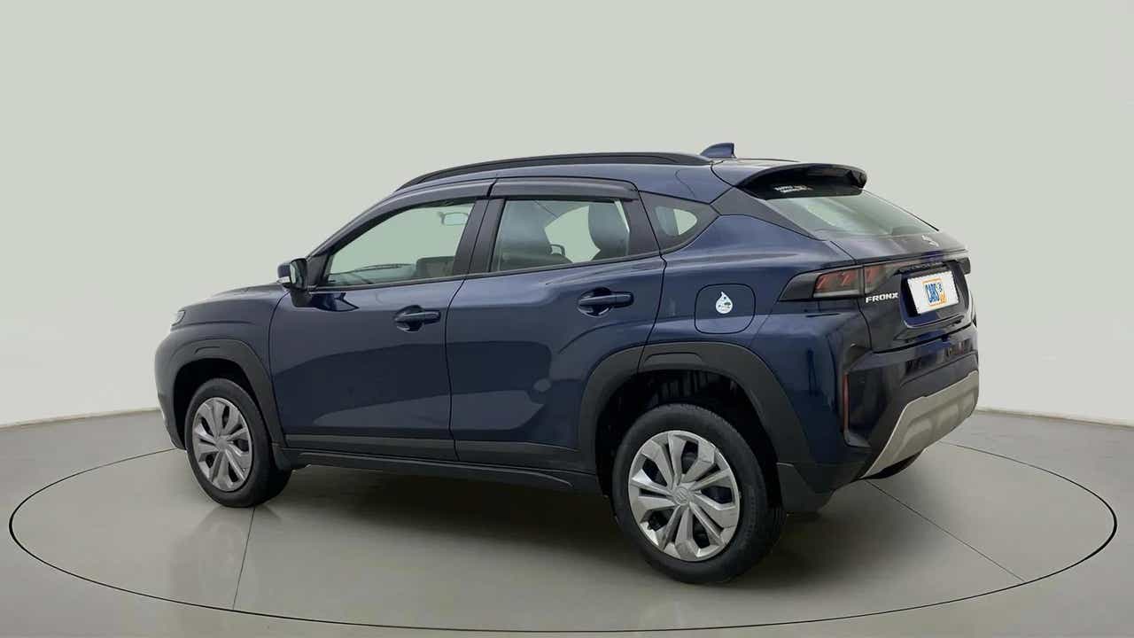 Rear three-quarter of a Nexa Blue Maruti Suzuki FRONX